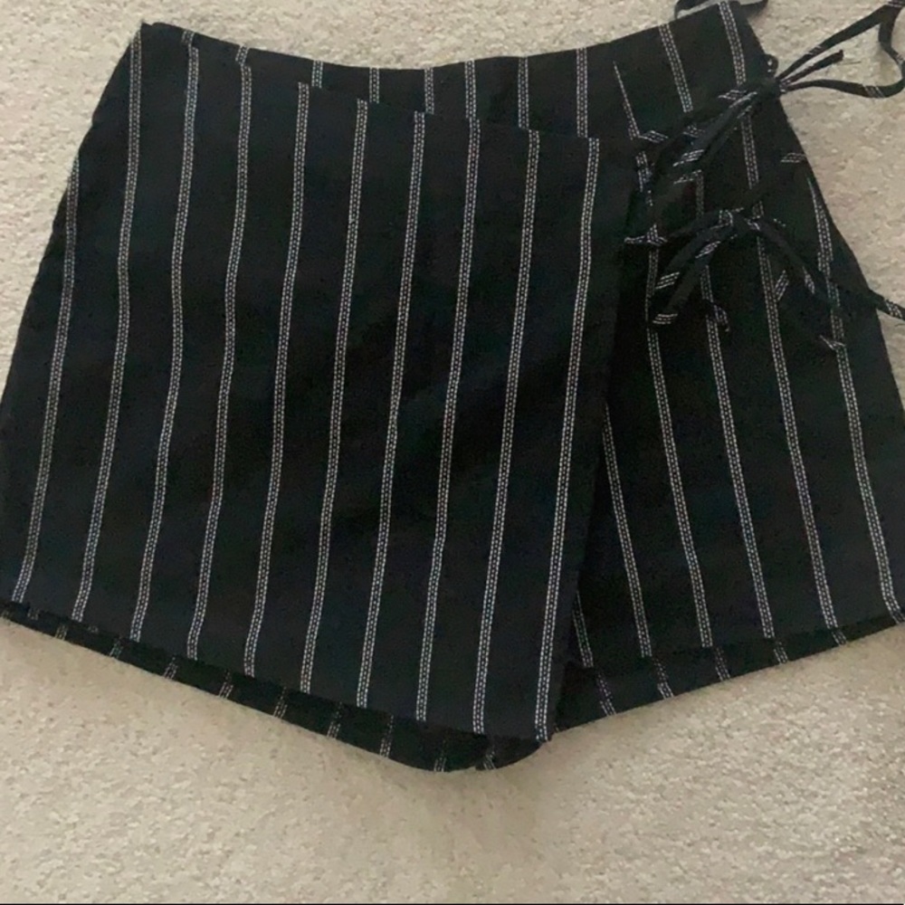 Black skirt with white lines - never been worn - has built in shorts.